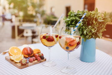 Top view of summer dinks, fruit cocktails on white wood table wi