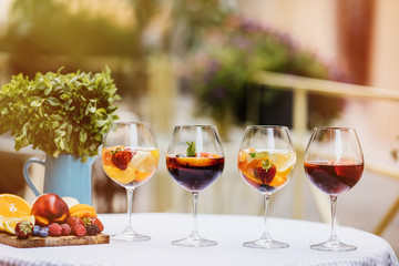 Top view of summer dinks, fruit cocktails on white wood table wi