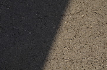  Shadow on the road, Texture of the concrete road, Road at sunset, Abstract surface. Close up the darkness, Concrete texture, shadow line. Space for text.