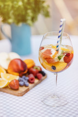 Top view of summer dinks, fruit cocktails on white wood table wi