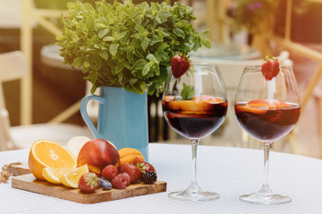 Top view of summer dinks, fruit cocktails on white wood table wi