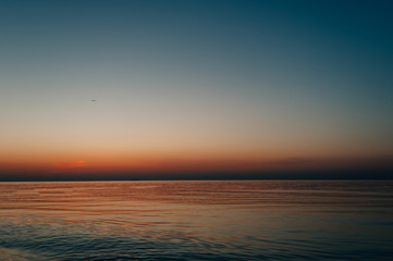 Fototapeta premium dawn should be the ocean, calm, cloudy
