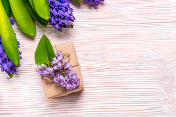 Gift box and Hyacinth flowers on wood backgroubd