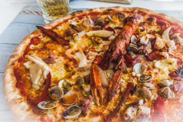 Italian pizza with ingredients based on fish