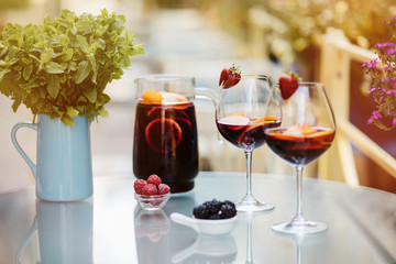 Top view of summer dinks, fruit cocktails on white wood table wi