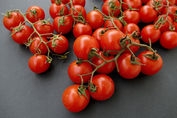 healthy vine tomatoes on the black back ground.
