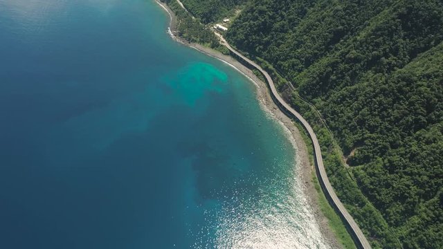 Aerial view of Patapat viaduct in the coast of Pagudpud, Ilocos Norte. Highway with bridge by coast sea near the mountains. Philippines, Luzon. Highway along the coast.