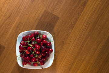 cherry in the plate on the table
