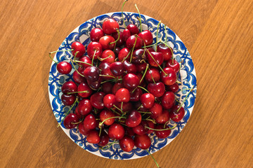 cherry in the plate on the table