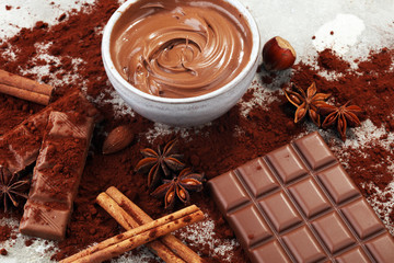 Chocolate bars on table with chocolate powder.