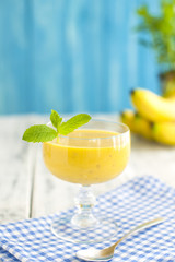 Fresh banana juice, a sunny morning. Healthy breakfast. Copy space