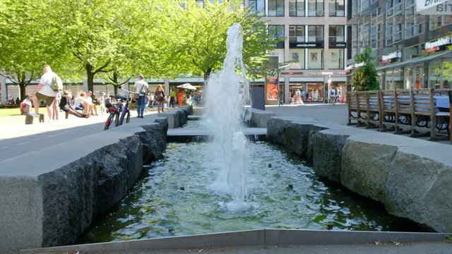 LEIPZIG,GERMANY - MAY 07, 2018: The walking people near fountain it isn't far from the area in the old center of Leipzig