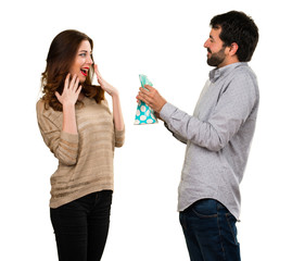 Man giving a gift to his girlfriend