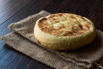 Turkish Flat Bread Bazlama on wooden surface
