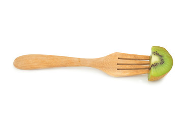kiwi slice on fork isolated on white background