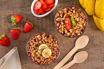 Acai berry cups on wooden background