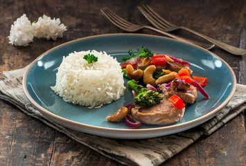 Sichuan pork, broccoli, red pepper and cashew stir-fry with rice
