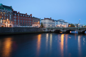 Fototapeta na wymiar Buildings at the Liffey riverbank in the early morning. Dublin, Ireland.