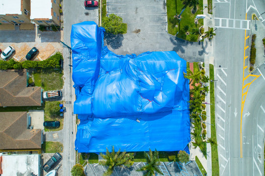 Aerial image building tented blue for fumigation