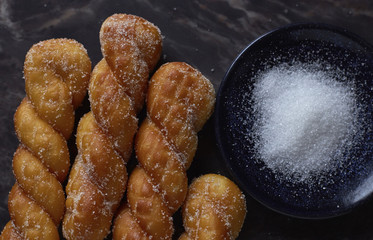 Overhead view of shakoy with sugar on table