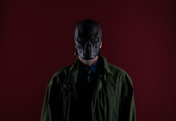 shadow portrait of a man in a black mask