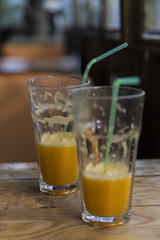 orange juice on wooden background 