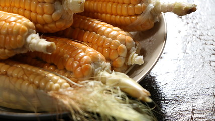 Raw corn on a plate macro close up shot
