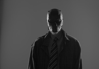 shadow portrait of a man in a black mask
