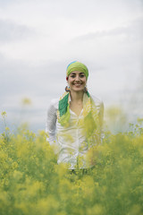 woman with colorful headscarf in the forest, has cancer