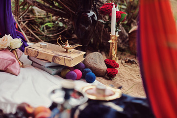 Oriental beauty. The tent on cushions. Aladdin lamp. smoking hookah. Fairy tale concept of the Arab harem or arabian night. East tale decoration