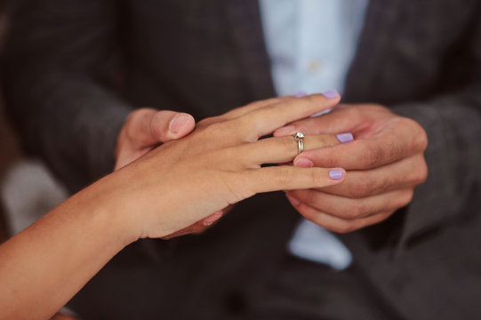 Hands of newlyweds or young lovely couple. Pair of lovers hands close up. Love together concept