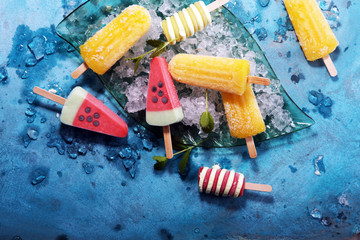 Colorful popsicle or Vanilla frozen yogurt or soft ice cream.