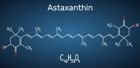 Astaxanthin is a keto-carotenoid. It belongs to class of chemical terpenes Structural chemical formula and molecule model on the dark blue background