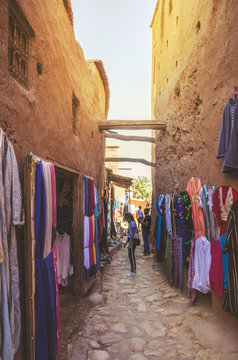 Narrow streets of Kasbah Ait Ben Haddou with traditional moroccan souvenirs, Morocco