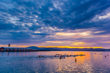Group rowing at sunrise, Tasmania, Australia
