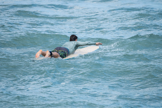 Unknown Surfer Paddles Out To Sea