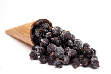 Ice cream cone made from  frozen black currant. Summer and Sweet Diet Freshness creative menu concept