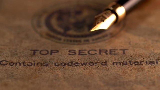 Fountain pen on top secret document