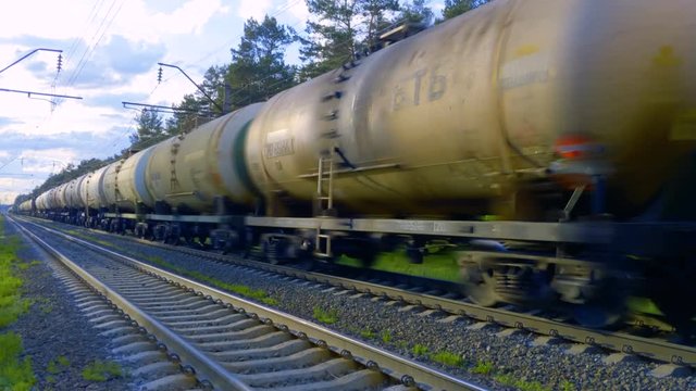 Railway tank cars with oil go on rails