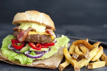 fresh tasty burger on dark background 