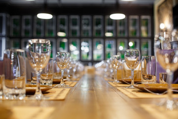 long served feast table
glass dining table served
festive table in the restaurant
decorated with gilding glasses.
interior restaurant
