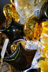 golden and black balloons.
The photo zone is decorated with black and yellow balloons .
round golden balloon.
 balloon in the form of a star.
stylish party with balloons.