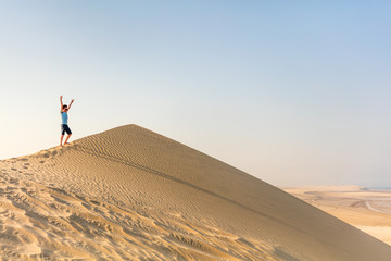 Teenage boy having fun at desert