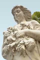 A low angle view of an angel statue with what appears to be a tear-stained face.
