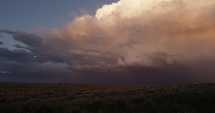 Prairie  storm at sunset darkens sage - dolly