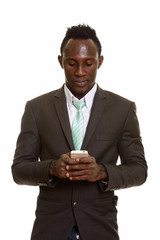 Young black African businessman using mobile phone