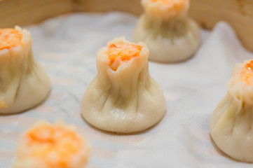 Steamed shrimp Shaomai dumpling in a bamboo basket