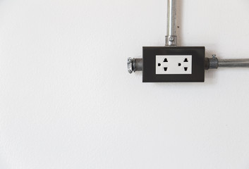 electric power socket on white wall