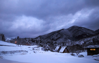 Snowscape with traditional Japanese gassho zukuri thatched roof homes in Shirakawago