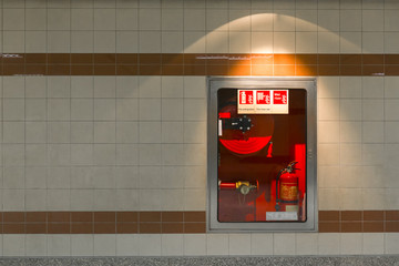 Hydrant with water hoses and fire extinguish equipment on the wall in an corridor.